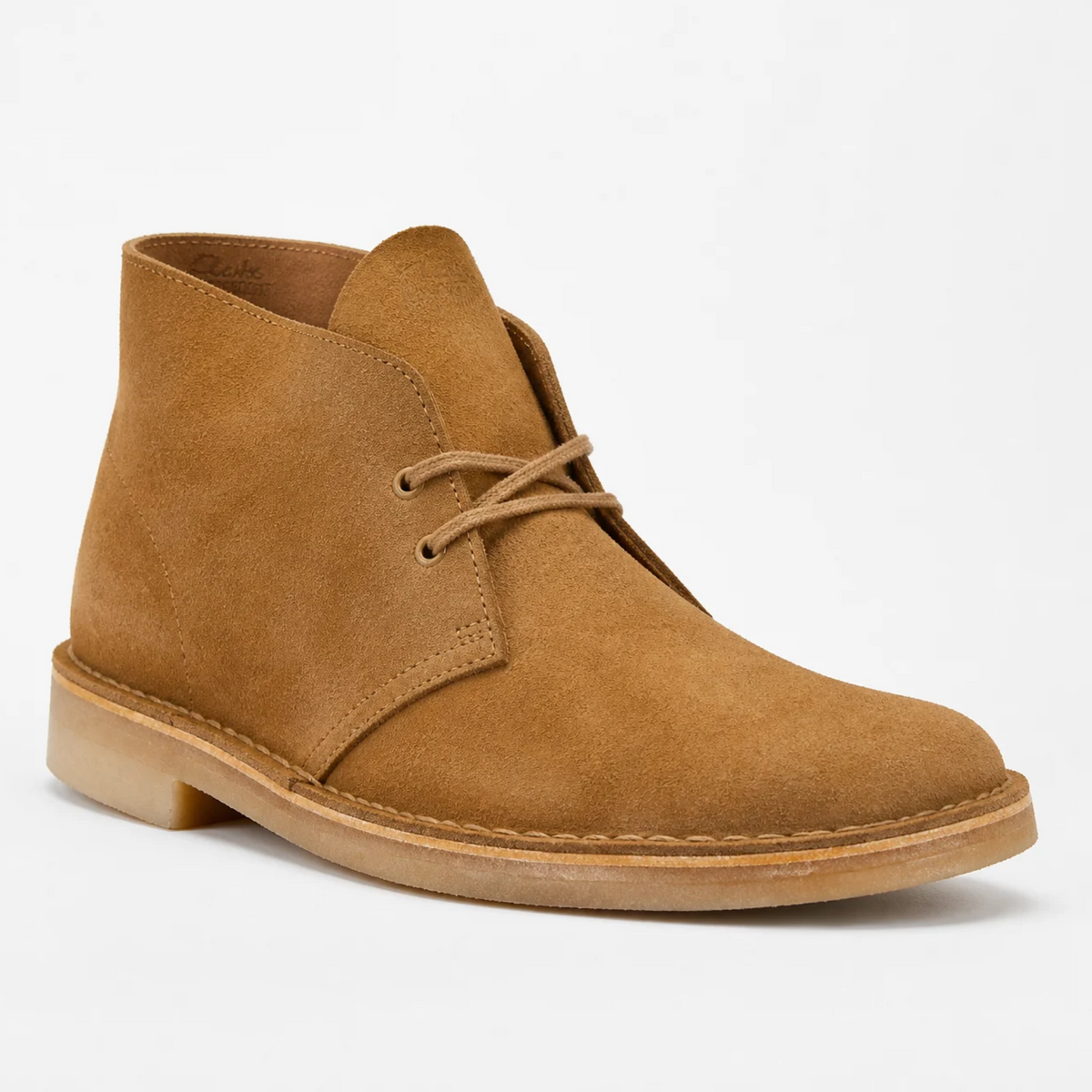 Akti neutral studio background-er samne rakha premium tan roonger suede material-er lace-up Chukka boot.